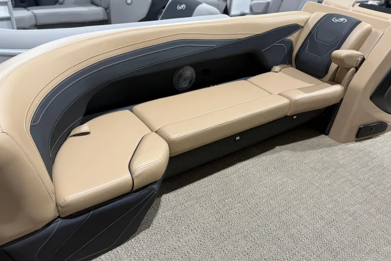 Slide: The Image of 2026 Barletta Cabrio 24UC boat interior with beige and black seating. - 5