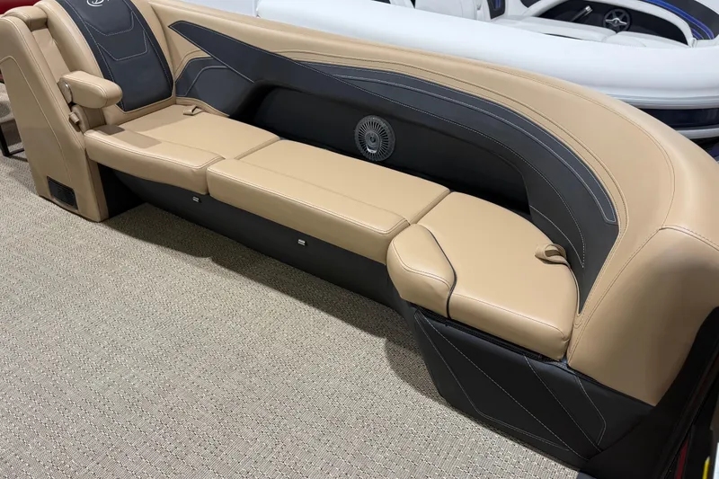 Slide: The Image of Luxurious seating in the 2026 Barletta Cabrio 24UC pontoon boat, featuring beige and black upholstery. - 6