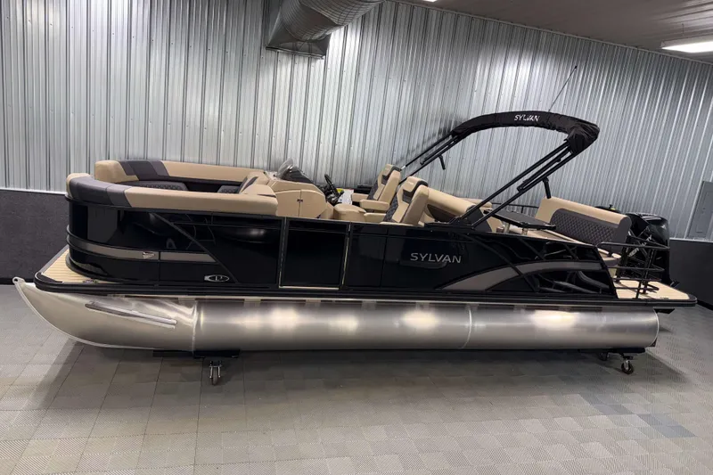 The Image of 2026 Sylvan L3 DLZ pontoon boat with sleek black design in a showroom. - 1