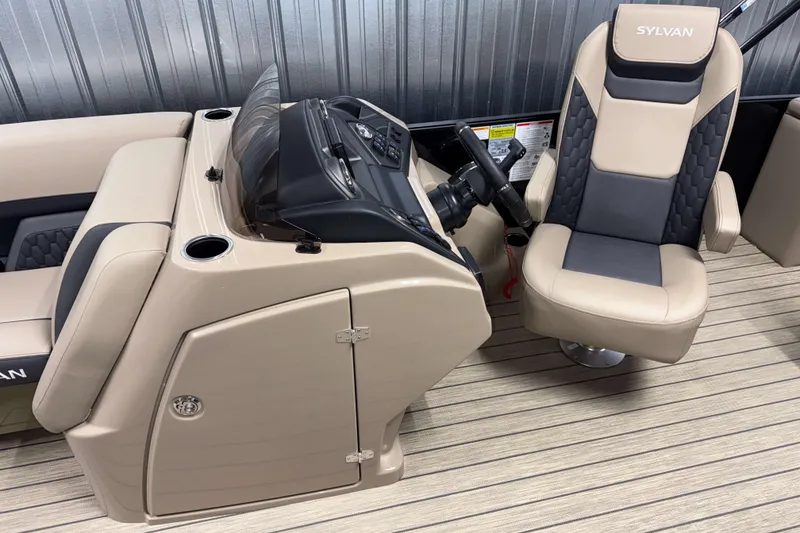 Slide: The Image of 2026 Sylvan L3 DLZ boat interior with beige captain's chair and control console. - 11
