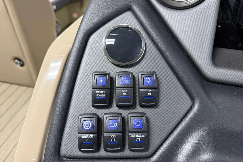 Slide: The Image of Control panel of 2026 Sylvan L3 DLZ boat with various light switches. - 14