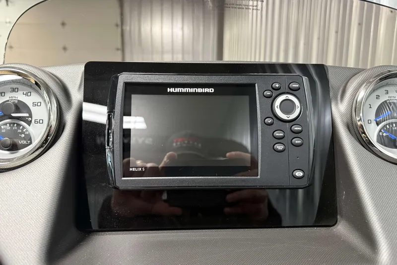 Slide: The Image of Dashboard of 2026 Sylvan L3 DLZ with Humminbird Helix 5 display and gauges. - 16