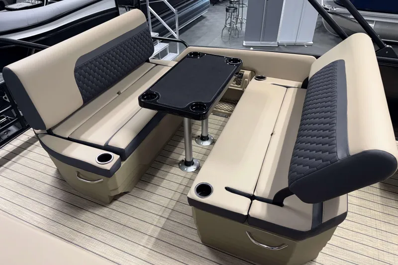 Slide: The Image of Luxurious seating area on 2026 Sylvan L3 DLZ pontoon boat with table and cup holders. - 18