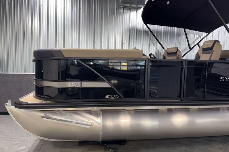 Slide: The Image of 2026 Sylvan L3 DLZ pontoon boat with sleek black design and comfortable seating. - 25