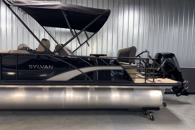 Slide: The Image of 2026 Sylvan L3 DLZ pontoon boat with canopy and outboard motor in showroom. - 27