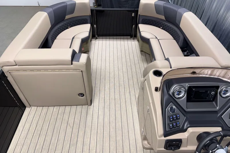 Slide: The Image of 2026 Sylvan L3 DLZ boat interior with beige seating and modern dashboard controls. - 8