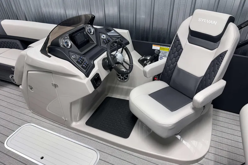 Slide: The Image of 2026 Sylvan L3 DLZ Platinum boat helm with modern controls and comfortable captain's chair. - 10