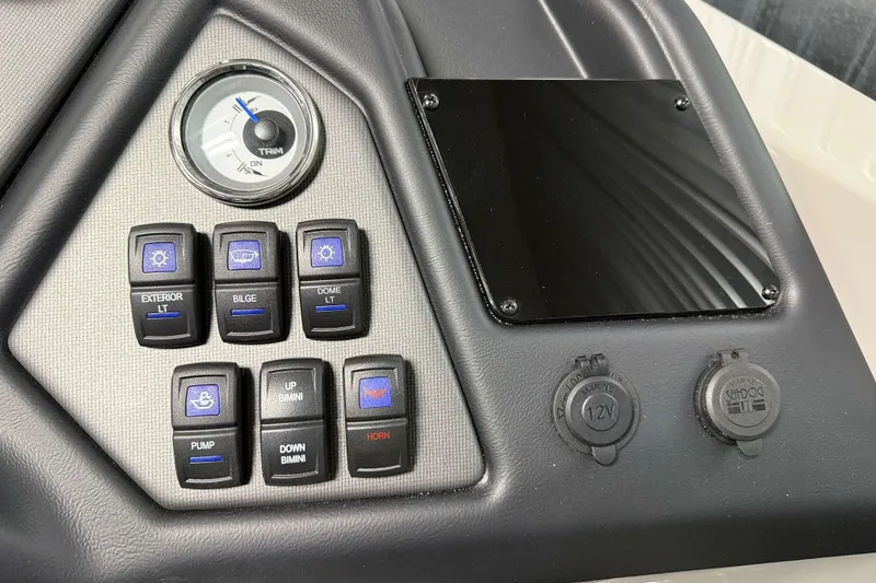 Slide: The Image of Control panel of 2026 Sylvan L3 DLZ Platinum boat with switches and gauges. - 15