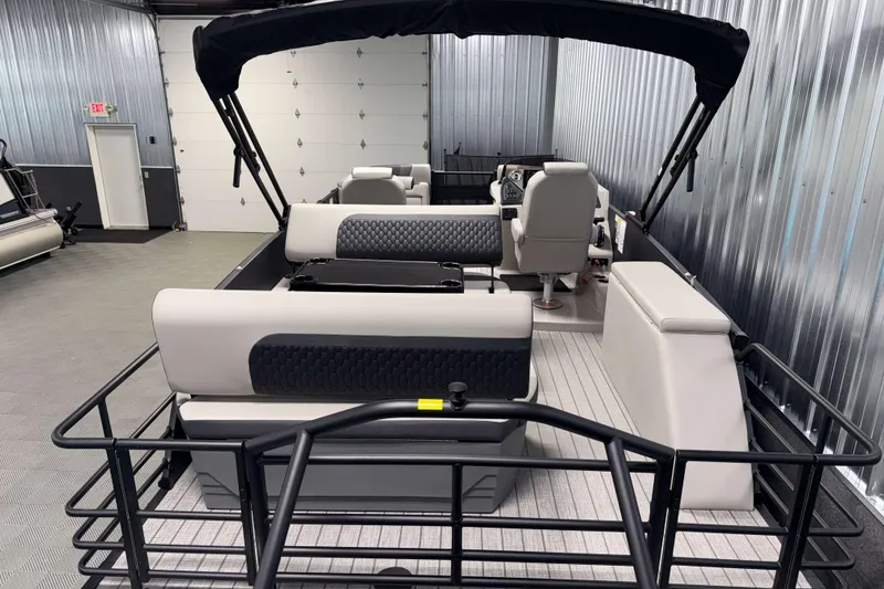 Slide: The Image of 2026 Sylvan L3 DLZ Platinum pontoon boat interior with modern seating and sleek design. - 20