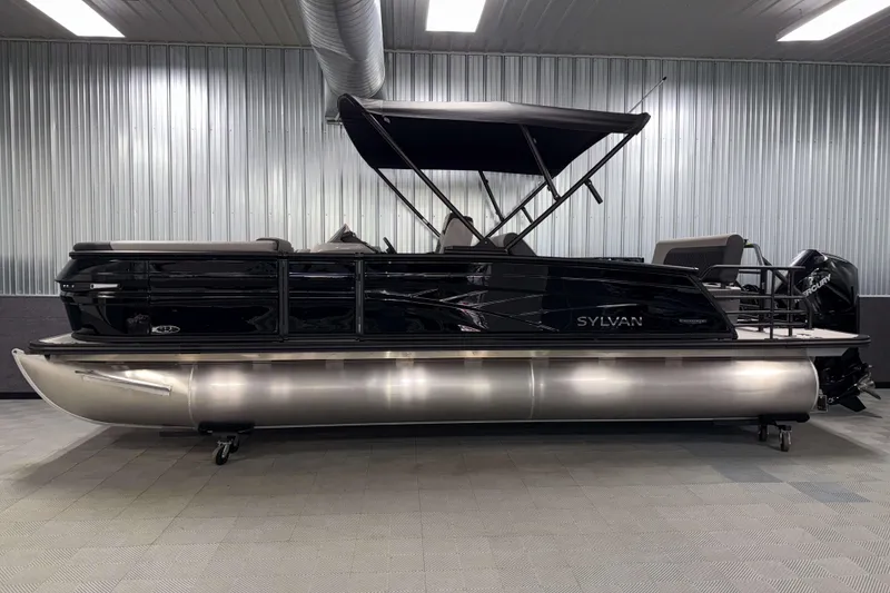 Slide: The Image of 2026 Sylvan L3 DLZ Platinum pontoon boat in a showroom setting. - 25