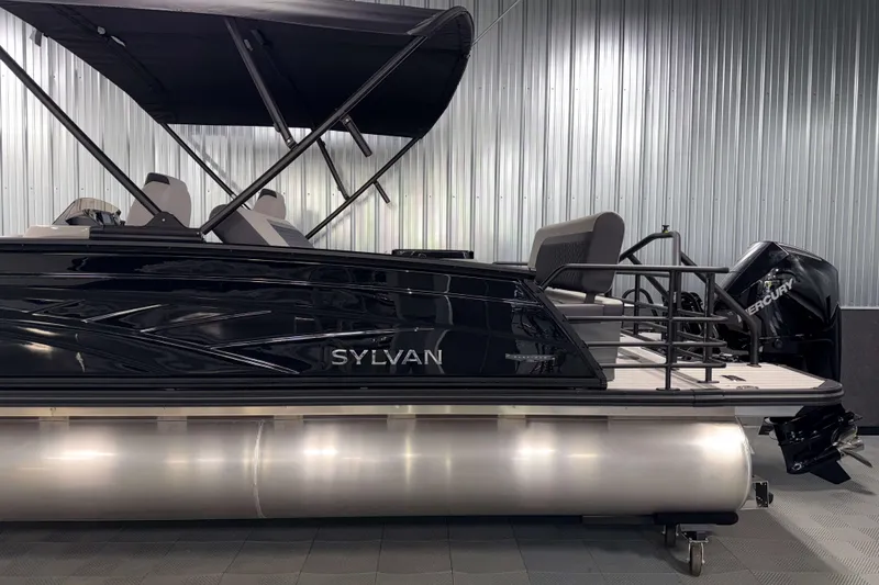 Slide: The Image of 2026 Sylvan L3 DLZ Platinum pontoon boat with Mercury engine in showroom. - 26