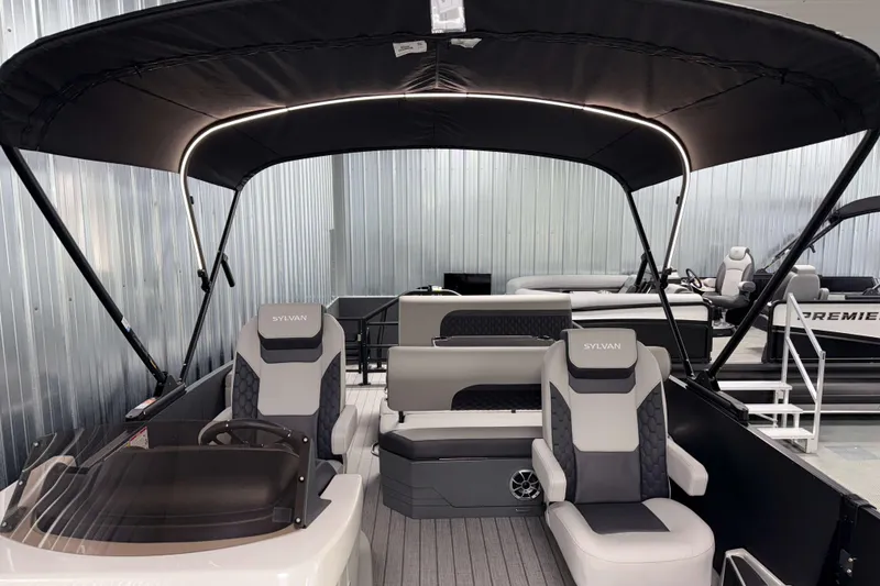 Slide: The Image of 2026 Sylvan L3 DLZ Platinum pontoon boat interior with modern seating and canopy. - 8