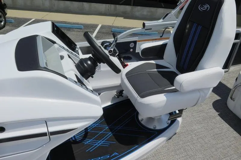 Slide: The Image of 2025 Barletta Corsa 23U boat cockpit with modern steering and seating. - 14