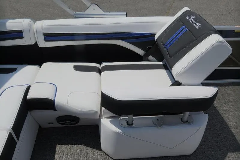 Slide: The Image of 2025 Barletta Corsa 23U boat interior with stylish white and black seating. - 21