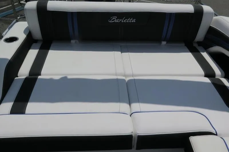 Slide: The Image of 2025 Barletta Corsa 23U boat seating with black and white upholstery. - 25
