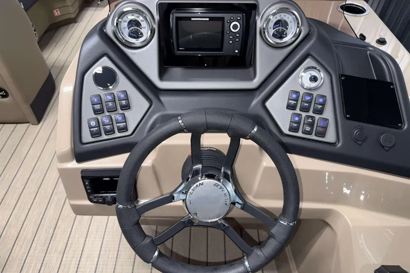 Slide: The Image of 2026 Sylvan L3 DLZ Bar boat dashboard with steering wheel and control panel. - 10