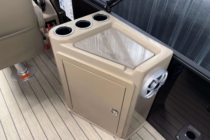 Slide: The Image of 2026 Sylvan L3 DLZ Bar boat interior with cup holders and speaker. - 21