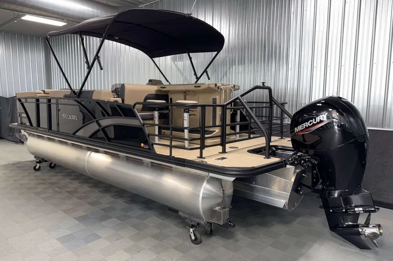Slide: The Image of 2026 Sylvan L3 DLZ Bar pontoon boat with Mercury outboard motor in a showroom. - 29