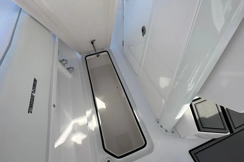 Slide: The Image of 2026 Twin Vee 280 GFX2 CC boat interior storage compartment, showcasing sleek design and functionality. - 10