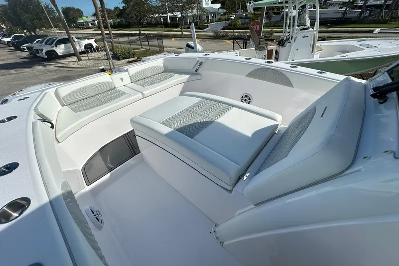 Slide: The Image of 2026 Twin Vee 280 GFX2 CC boat interior with cushioned seating and modern design. - 6