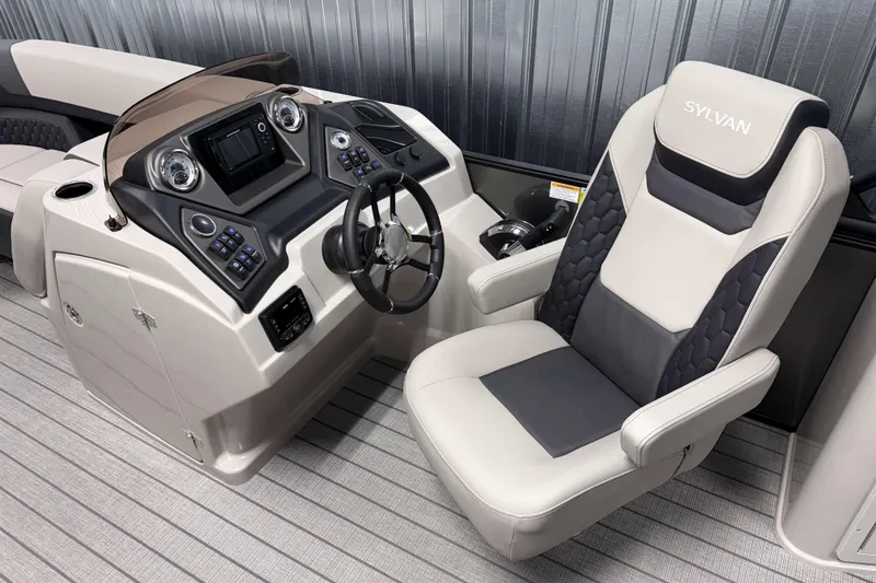 Slide: The Image of 2026 Sylvan L3 DLZ Bar boat interior with modern helm and comfortable captain's chair. - 10