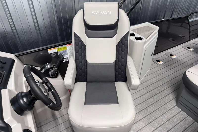 Slide: The Image of Captain's chair and helm of 2026 Sylvan L3 DLZ Bar boat, featuring modern design. - 11