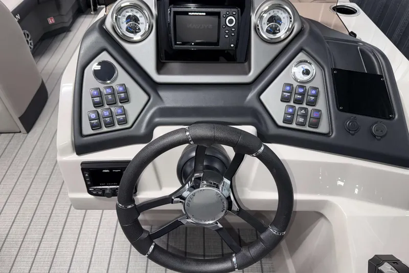 Slide: The Image of 2026 Sylvan L3 DLZ Bar boat dashboard with steering wheel and control panel. - 12