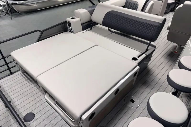 Slide: The Image of Luxurious seating area on 2026 Sylvan L3 DLZ Bar pontoon boat, featuring plush cushions and modern design. - 18
