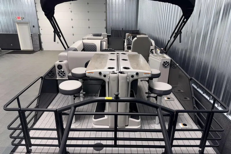 Slide: The Image of 2026 Sylvan L3 DLZ Bar pontoon boat with bar seating and modern interior. - 22