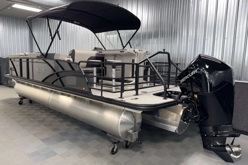 Slide: The Image of 2026 Sylvan L3 DLZ Bar pontoon boat with Mercury outboard motor in showroom. - 31