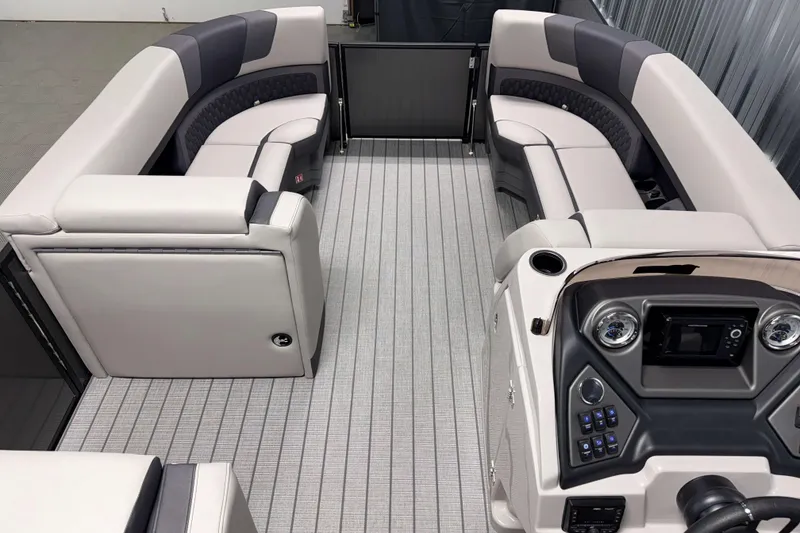 Slide: The Image of 2026 Sylvan L3 DLZ Bar pontoon boat interior with luxurious seating and modern dashboard. - 6