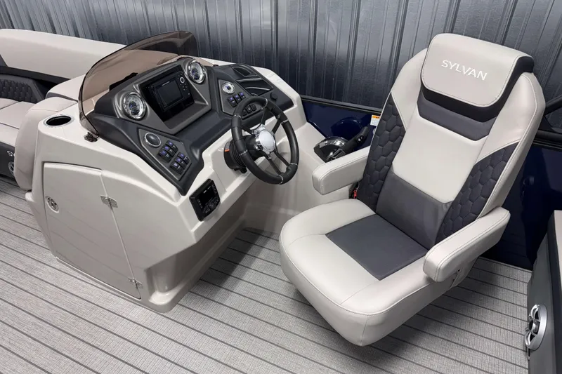 Slide: The Image of 2026 Sylvan L3 RLZ boat interior with modern helm and comfortable captain's chair. - 10