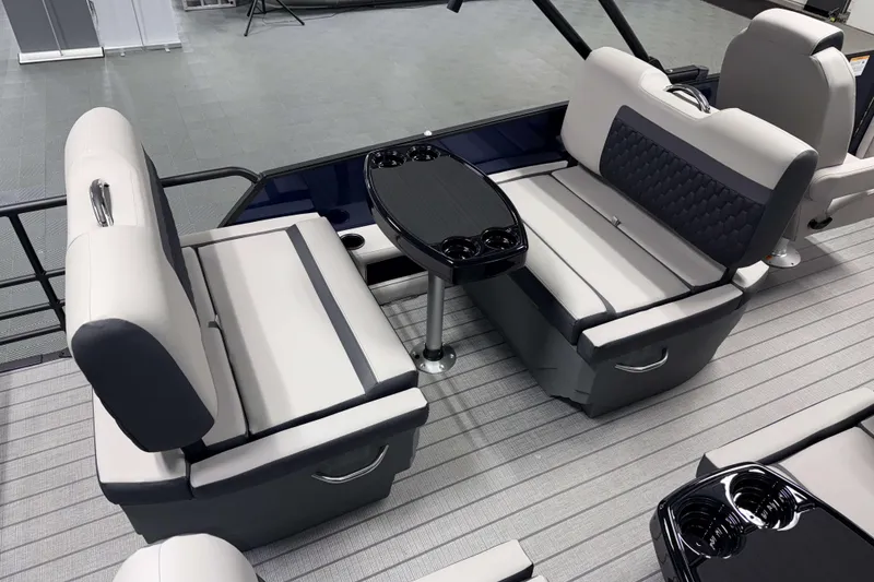 Slide: The Image of Luxurious seating area on 2026 Sylvan L3 RLZ boat with modern design and cup holders. - 17