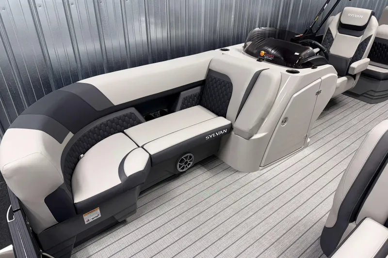 Slide: The Image of 2026 Sylvan L3 RLZ pontoon boat interior with sleek seating and modern design. - 2