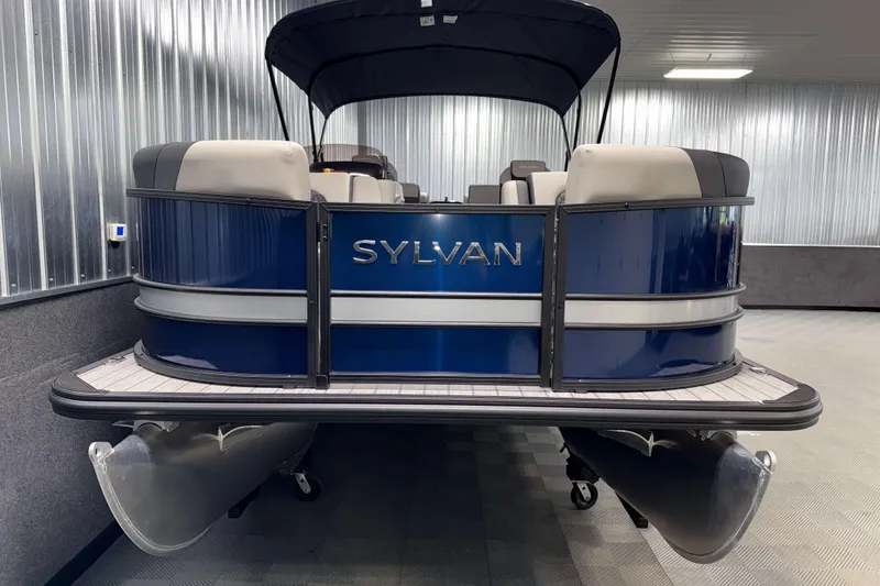 Slide: The Image of 2026 Sylvan L3 RLZ pontoon boat in showroom, featuring sleek design and modern seating. - 31