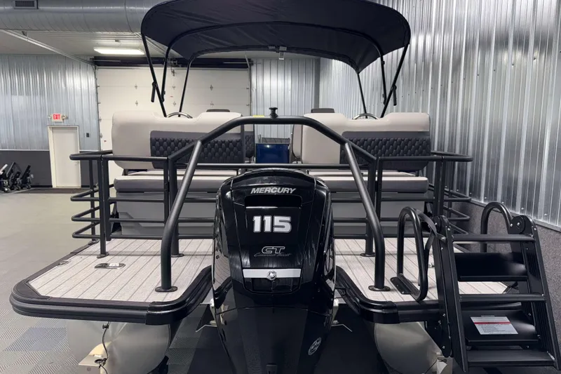 Slide: The Image of 2026 Sylvan L3 RLZ pontoon boat with Mercury 115 engine in a showroom. - 36