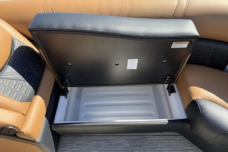 Slide: The Image of Open storage compartment in 2026 Premier 230 Intrigue RF boat seat. - 10