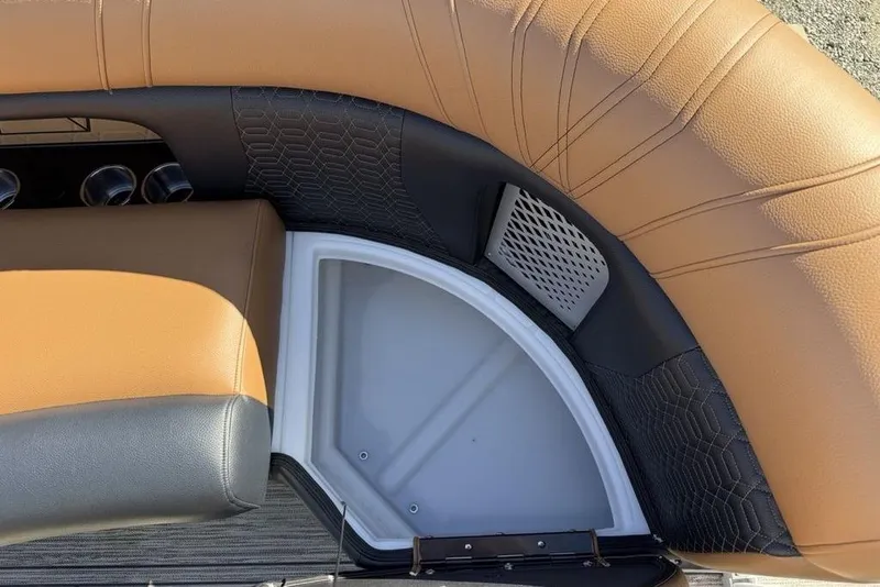 Slide: The Image of 2026 Premier 230 Intrigue RF boat interior with tan and black seating detail. - 11