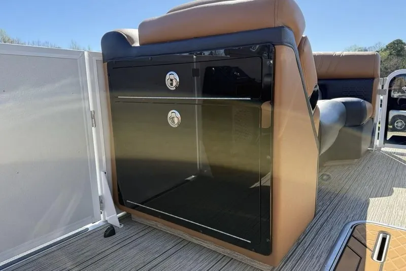 Slide: The Image of 2026 Premier 230 Intrigue RF boat interior with sleek storage compartment and comfortable seating. - 18