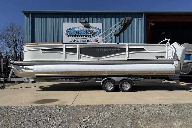 The Image of 2026 Premier 230 Intrigue RF pontoon boat on trailer at Foothills Marine Center. - 2