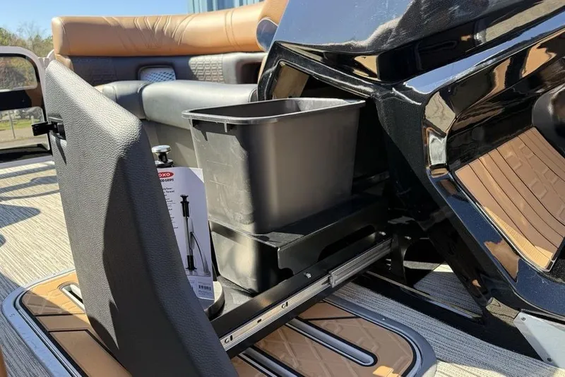 Slide: The Image of Interior of 2026 Premier 230 Intrigue RF boat with storage compartment and seating. - 21