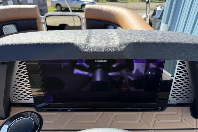 Slide: The Image of Dashboard of 2026 Premier 230 Intrigue RF boat featuring Simrad display. - 26