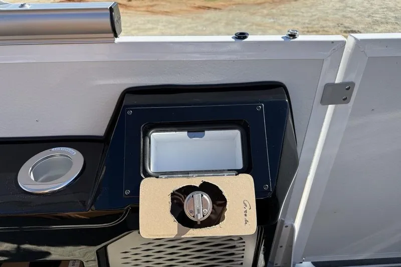 Slide: The Image of Control panel of 2026 Premier 230 Intrigue RF boat with cup holder and latch. - 30