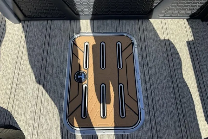 Slide: The Image of Hatch on 2026 Premier 230 Intrigue RF boat deck, featuring textured flooring. - 32