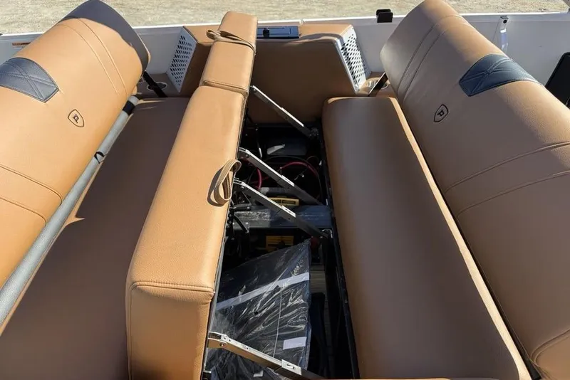 Slide: The Image of Premier 230 Intrigue RF 2026 boat interior with tan leather seating and storage compartments. - 35