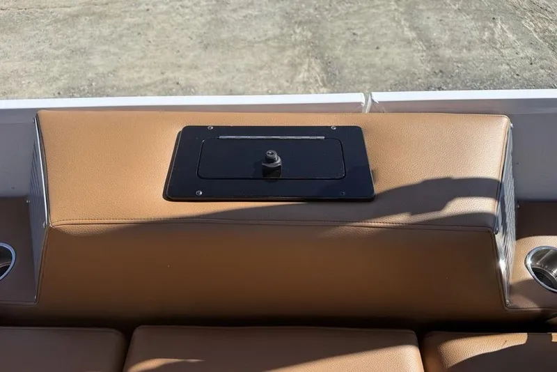 Slide: The Image of 2026 Premier 230 Intrigue RF boat interior with tan seating and cup holders. - 43