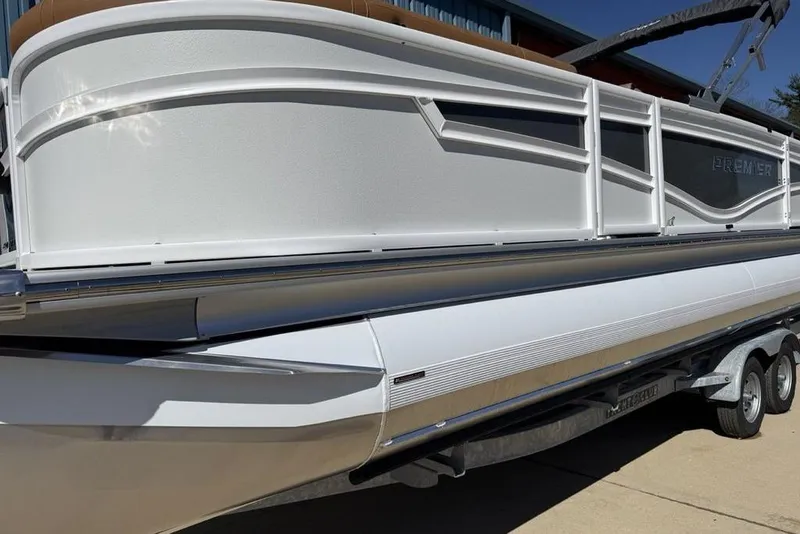 Slide: The Image of 2026 Premier 230 Intrigue RF pontoon boat on trailer, showcasing sleek design and modern features. - 5