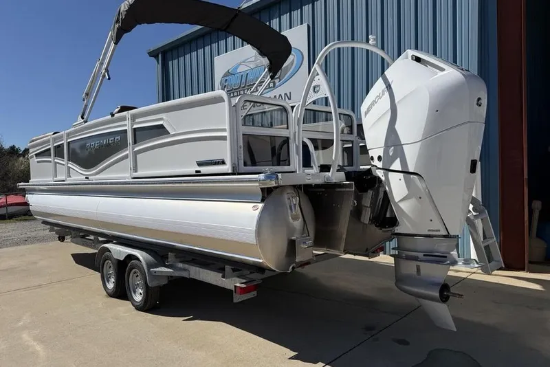 Slide: The Image of 2026 Premier 230 Intrigue RF pontoon boat with outboard motor on trailer. - 6