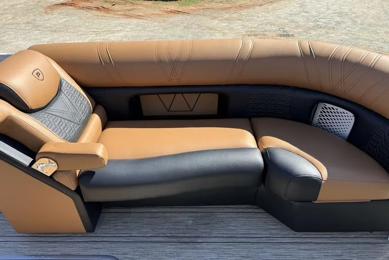 Slide: The Image of Luxurious seating on 2026 Premier 230 Intrigue RF boat, featuring tan and black upholstery. - 8