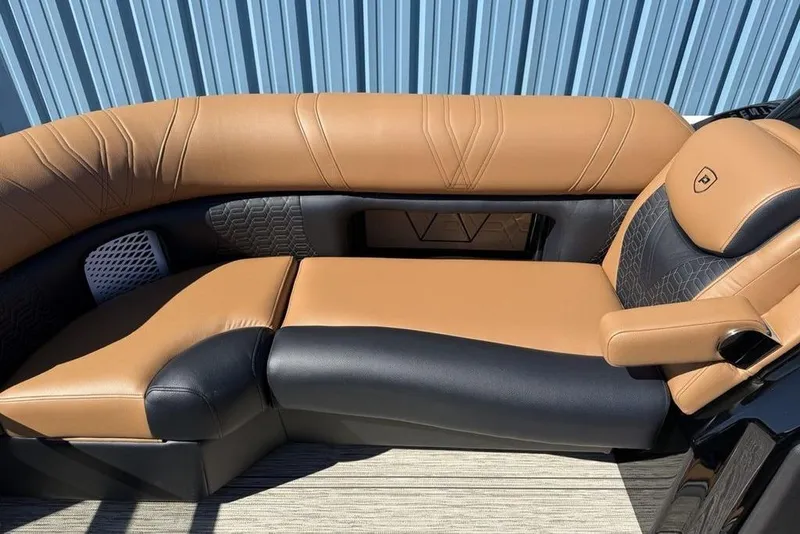 Slide: The Image of Luxurious tan and black seating on 2026 Premier 230 Intrigue RF boat. - 9